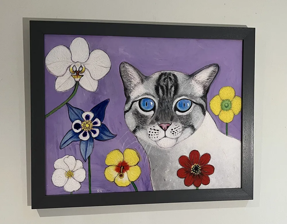 Blue eyed tabby in flowers